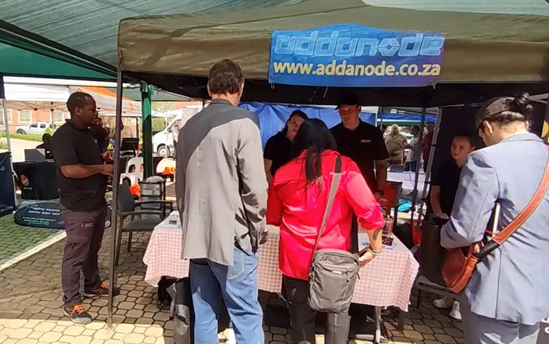 A busy addanode gazebo with visitors during Adroit Customer Day