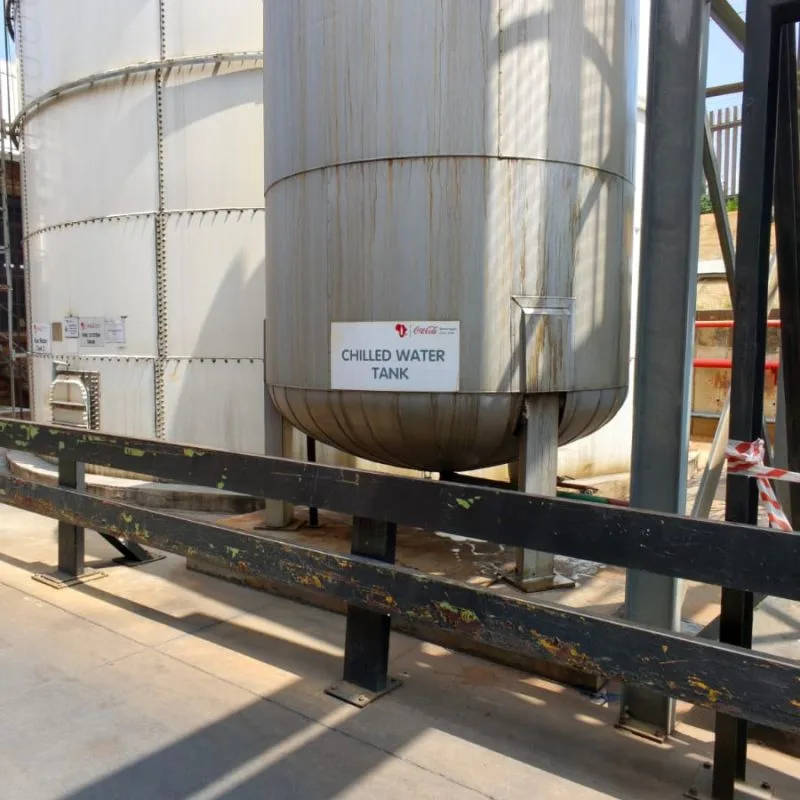 Chilled water tank with Coca-Cola Beverages South Africa signage at the plant's water infrastructure